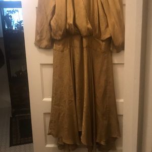 Gorgeous Vintage silk dress says 14 fits like 12. Crisscross front and tie back.